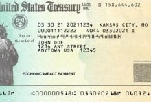 IRS holding tax refund with image of check